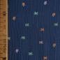 Preview: Musselin Double Gauze kleine bunte Schmetterlinge auf blau